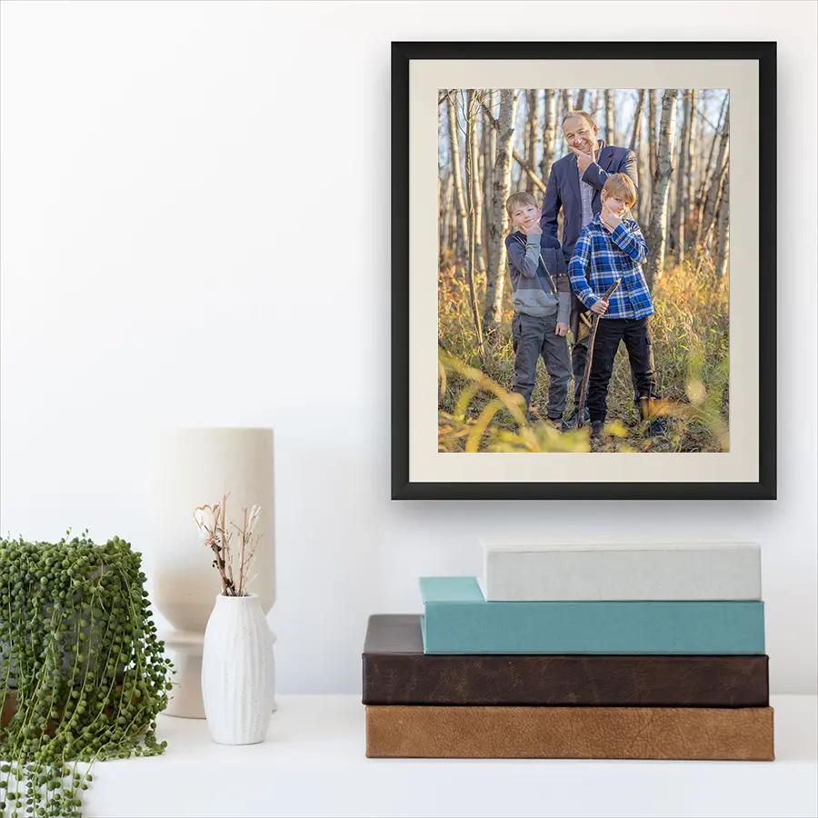 A close-up of a handcrafted leather heirloom photo album and museum-quality fine art prints by Winnipeg photographer Jason Lee.