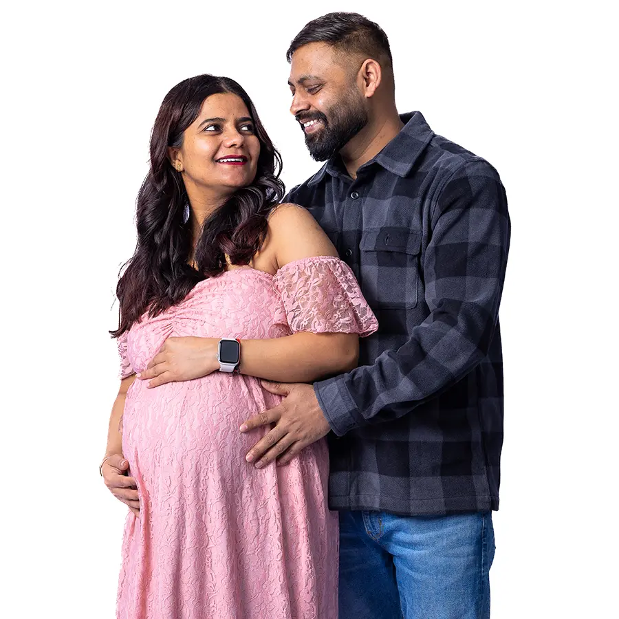 An Elegant studio maternity portrait of a woman and her partner in Jason Lee's Winnipeg photography studio.