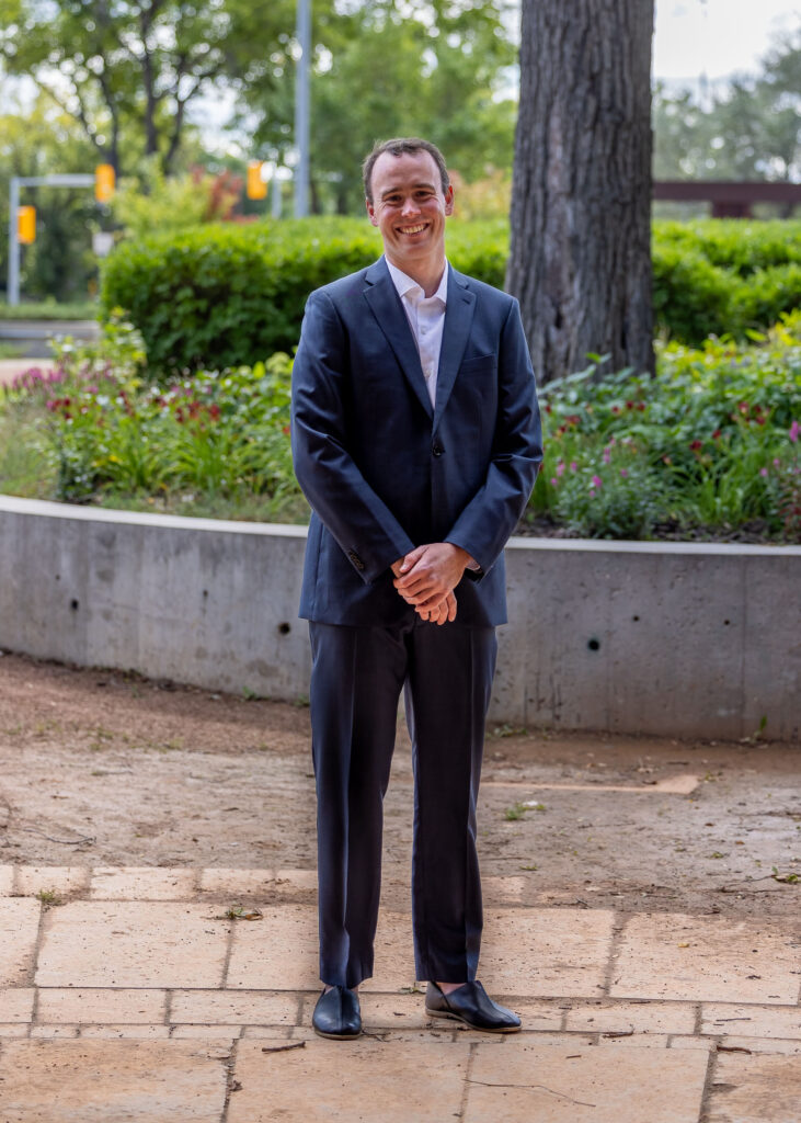 Groom portrait outdoors near Upper Fort Garry in Winnipeg