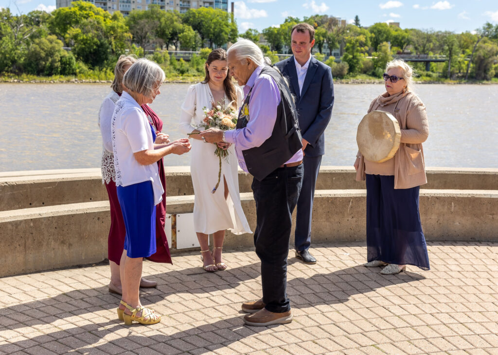 Smudging during an outdoor Métis wedding ceremony at The Forks in Winnipeg