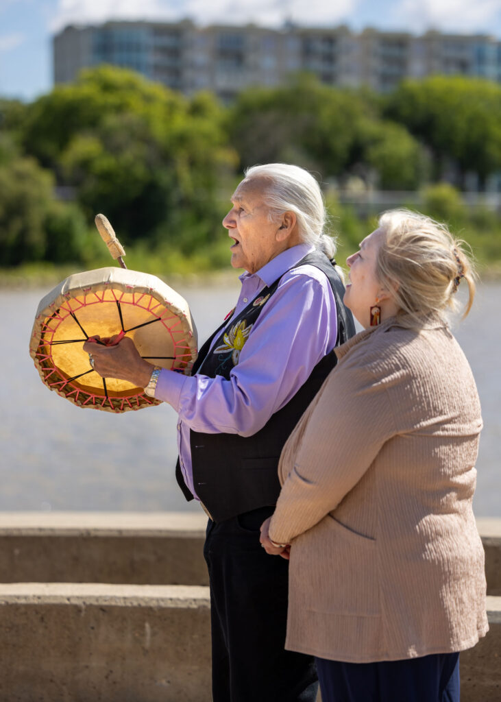 Drumming during a Métis wedding ceremony beside the Red River at The Forks