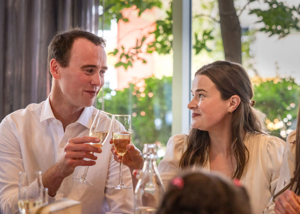 Newlyweds sharing a champagne toast during their lunch reception at Inn at the Forks