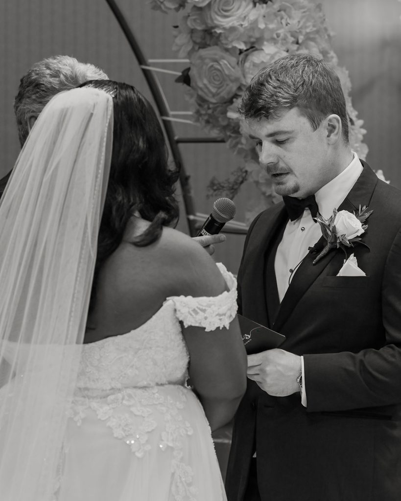 Groom reading his vows during the wedding ceremony at the Viscount Gort Hotel