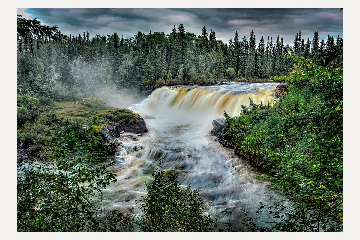 Pisew Falls surrounded by boreal forest in northern Manitoba