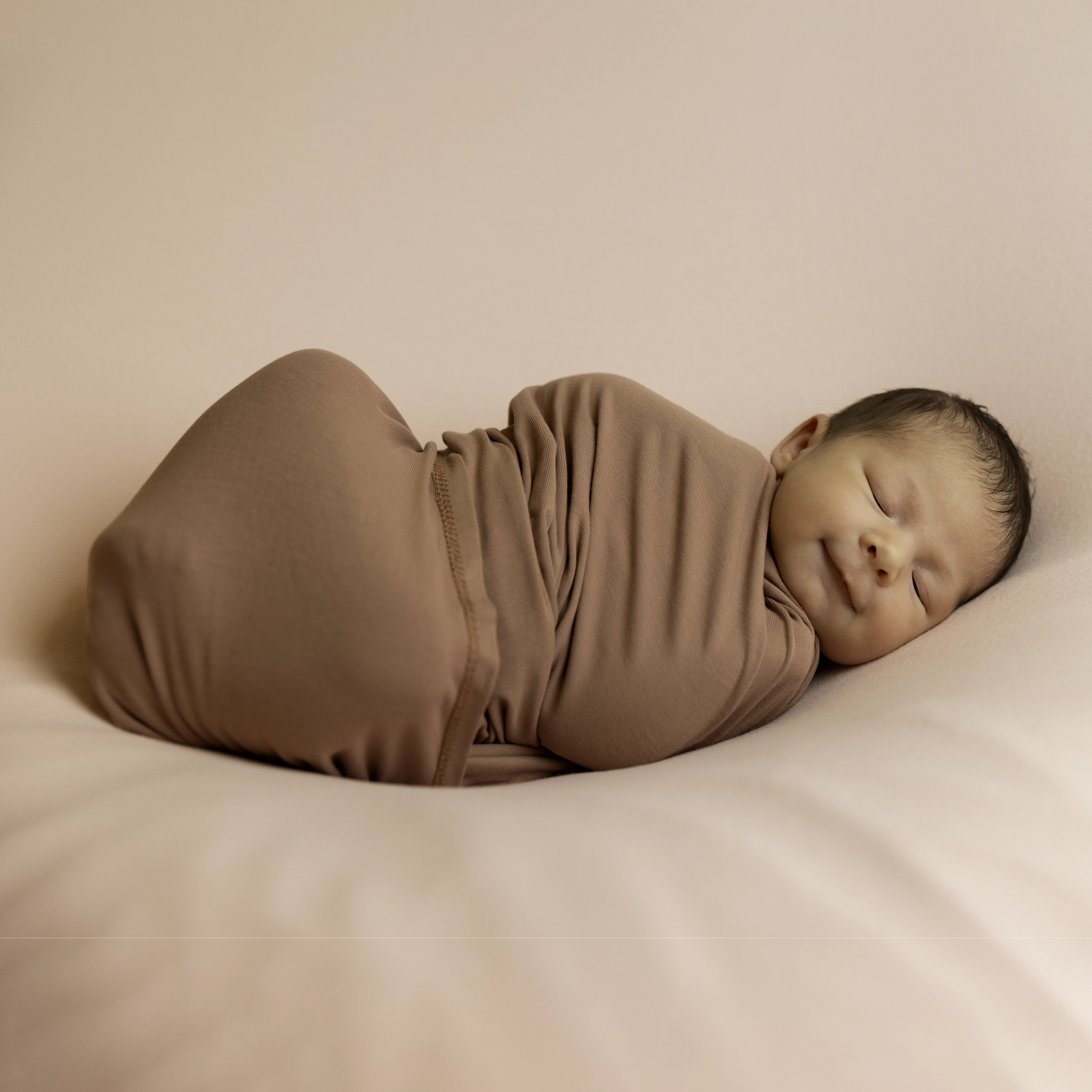Newborn baby wrapped during a Winnipeg studio newborn session