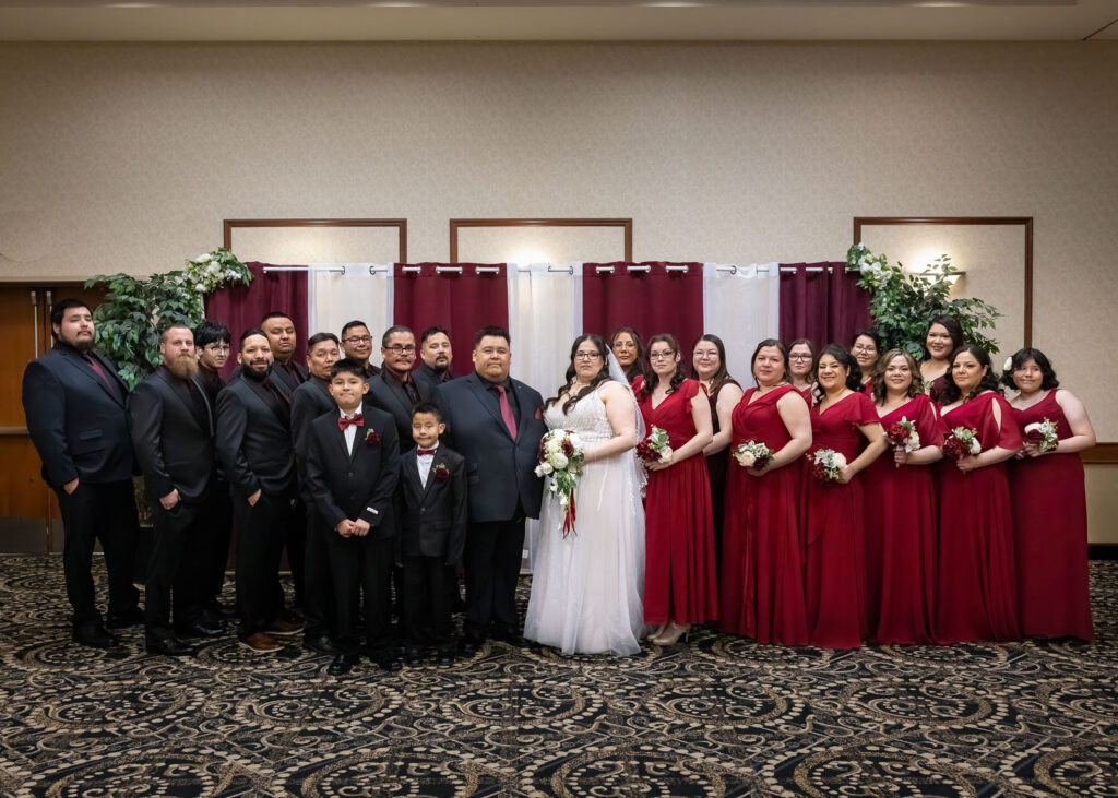Large wedding party portrait inside the Victoria Inn in Winnipeg