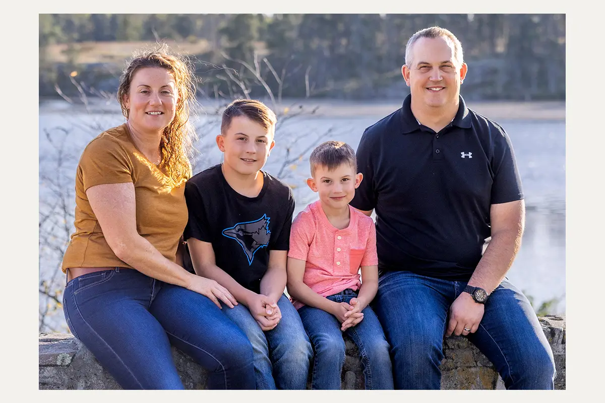 Family sitting together at Alf Hole Goose Sanctuary in Whiteshell Provincial Park