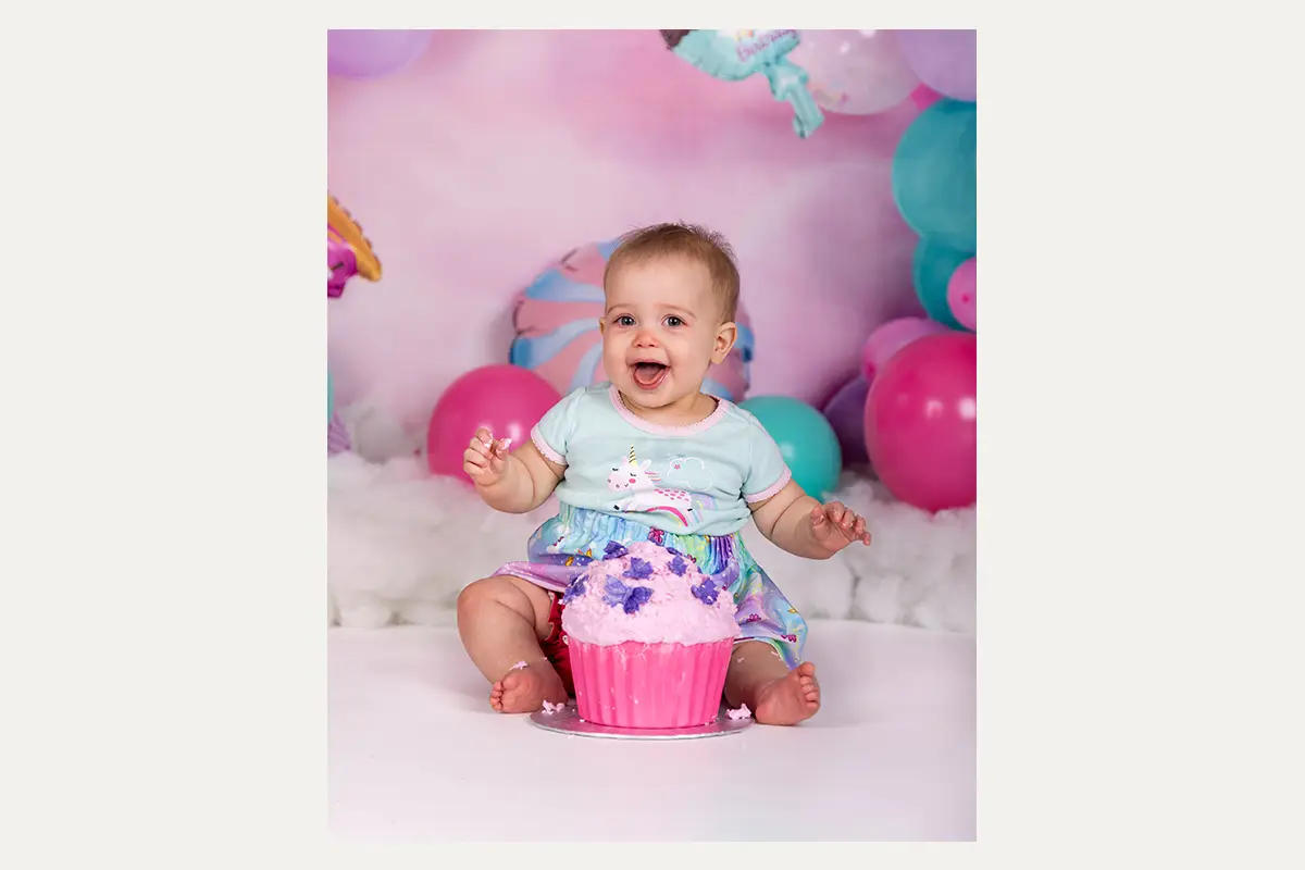 One-year-old celebrating a cake smash in a Winnipeg studio
