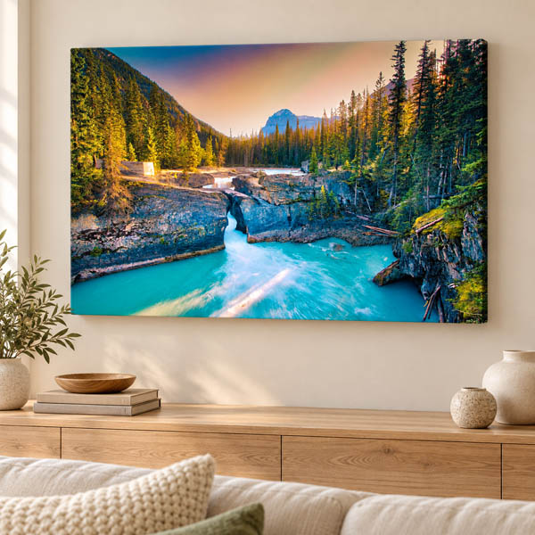 Natural Bridge landscape photograph displayed as a canvas print above a wooden console
