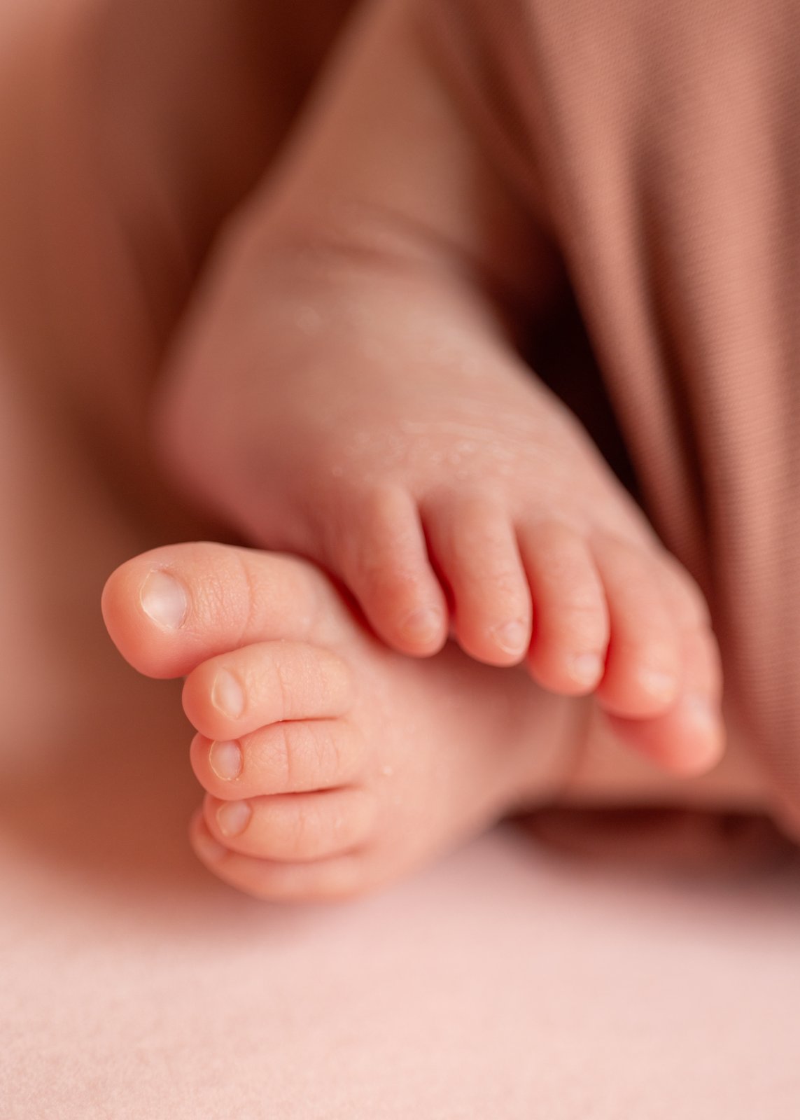 Close-up of a newborn baby’s tiny toes.