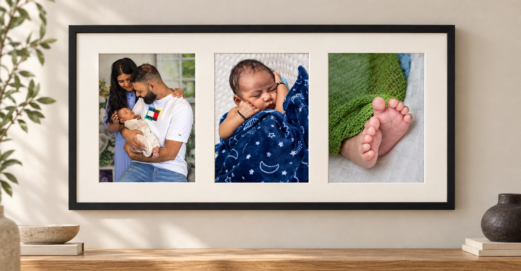One black frame with a white mat and three portrait 5 by 7 openings displaying parents with their newborn, a sleeping baby and tiny feet.